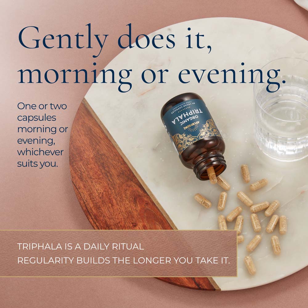 A bottle of Triphala Organic capsules with text &