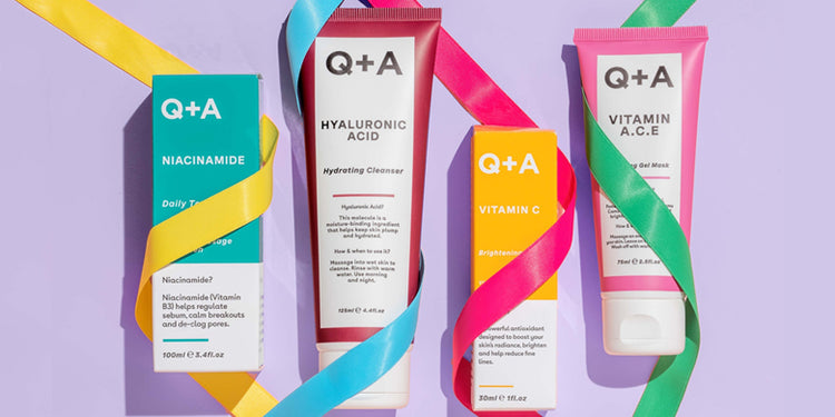 Selection of Q+A skincare products wrapped in coloured ribbons