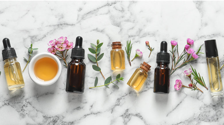 bottles of oil on marble background