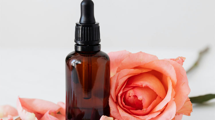 Brown glass serum bottle with rose