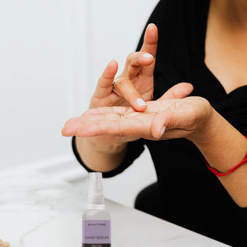 woman applying BeautyPro Hydrating Hand Serum