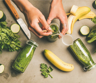 Green smoothies and vegetables flat lay