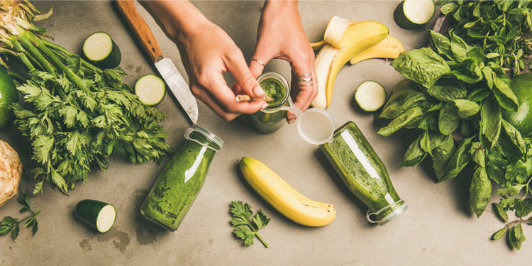 Green smoothies and vegetables flat lay