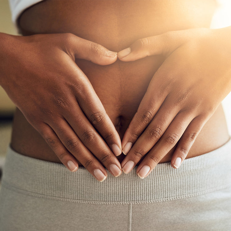 hands holding a bare tummy