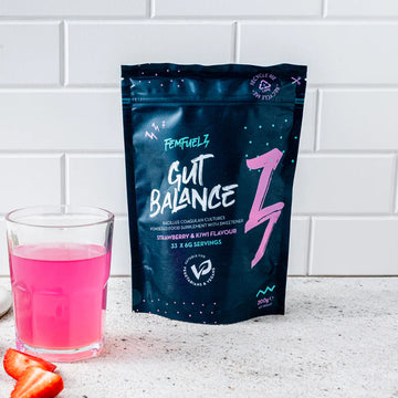 FemFuelz Gut Balance with pink drink and strawberries