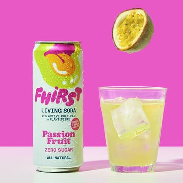 glass of Fhirst Passion Fruit Living Soda with fresh passion fruit