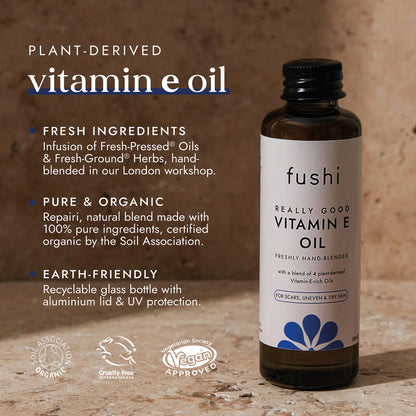 Fushi Vitamin E oil bottle with product details on a wooden background