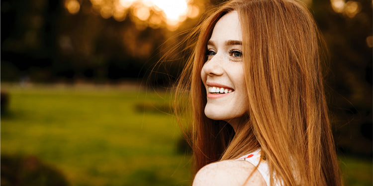 Smiling woman with red hair