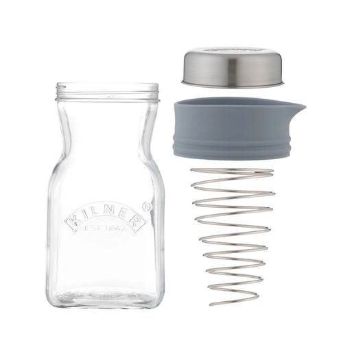 Clear glass bottle with metal lid and gray silicone sleeve on a white background