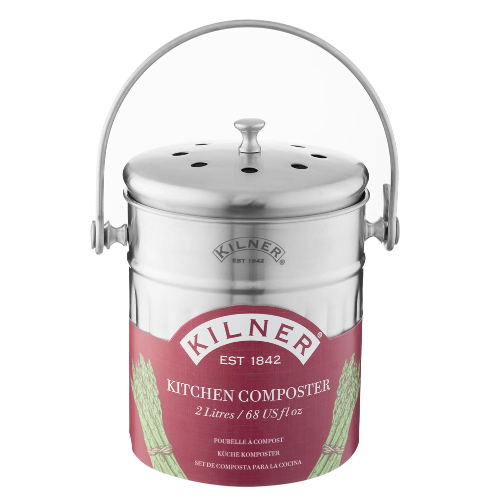 Kilner Kitchen Composter in polished stainless steel with a matching metal handle and lid, featuring a pink and white label with green leaf graphics.