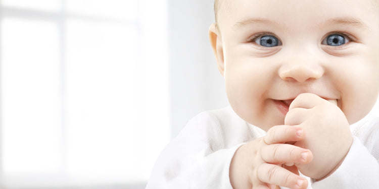 Smiling baby on white background