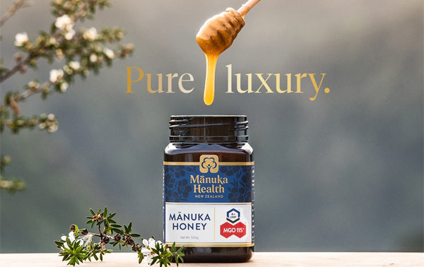 Jar of Manuka Honey with honey dipper