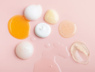 range of gel and cream textures on a pink background