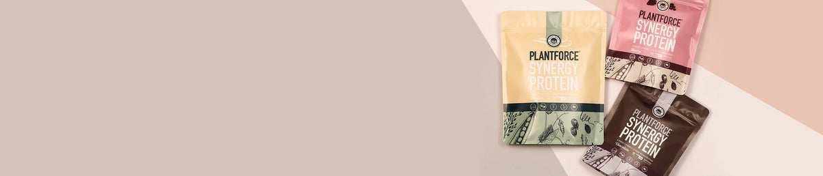Three Plantforce protein powder pouches arranged on a beige and peach background.