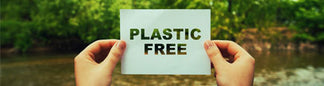 hands holding sign saying 'plastic free'