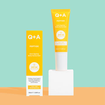 Q+A Peptide SPF 50 Anti-Ageing Daily Sunscreen with colourful background