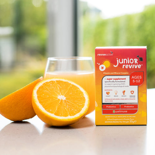 Revive Active Junior with oranges and glass