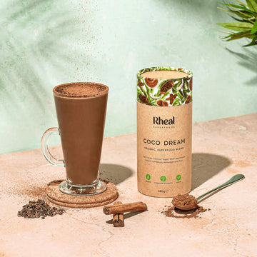 Rheal Coco Dream Superfoods in a tall glass