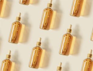 Gold serum bottles flat lay image