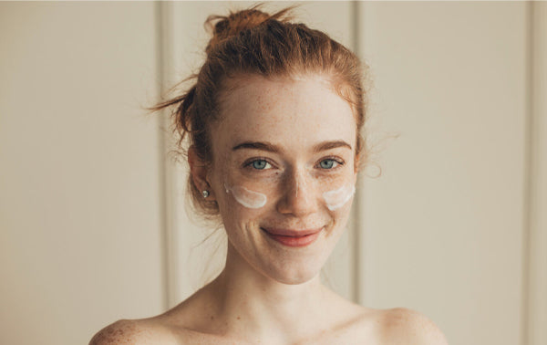 healthy women with moisturiser on her face