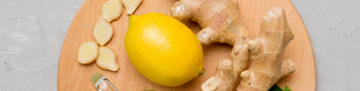 lemon and ginger on a wooden chopping board