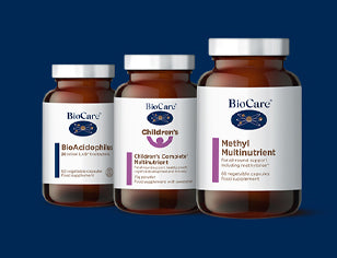 Three bottles of BioCare supplements on a blue background