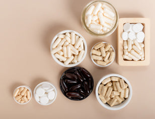 selection of neutral colour supplements on a beige background