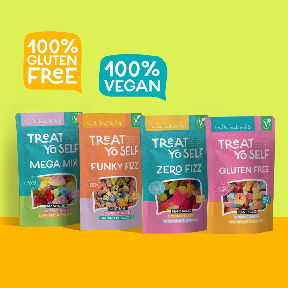 Four stand-up pouches of Treat Yo Self gluten free snacks are displayed against a bright lime green and orange background, accompanied by two promotional badges reading '100% Gluten Free' and '100% Vegan'.