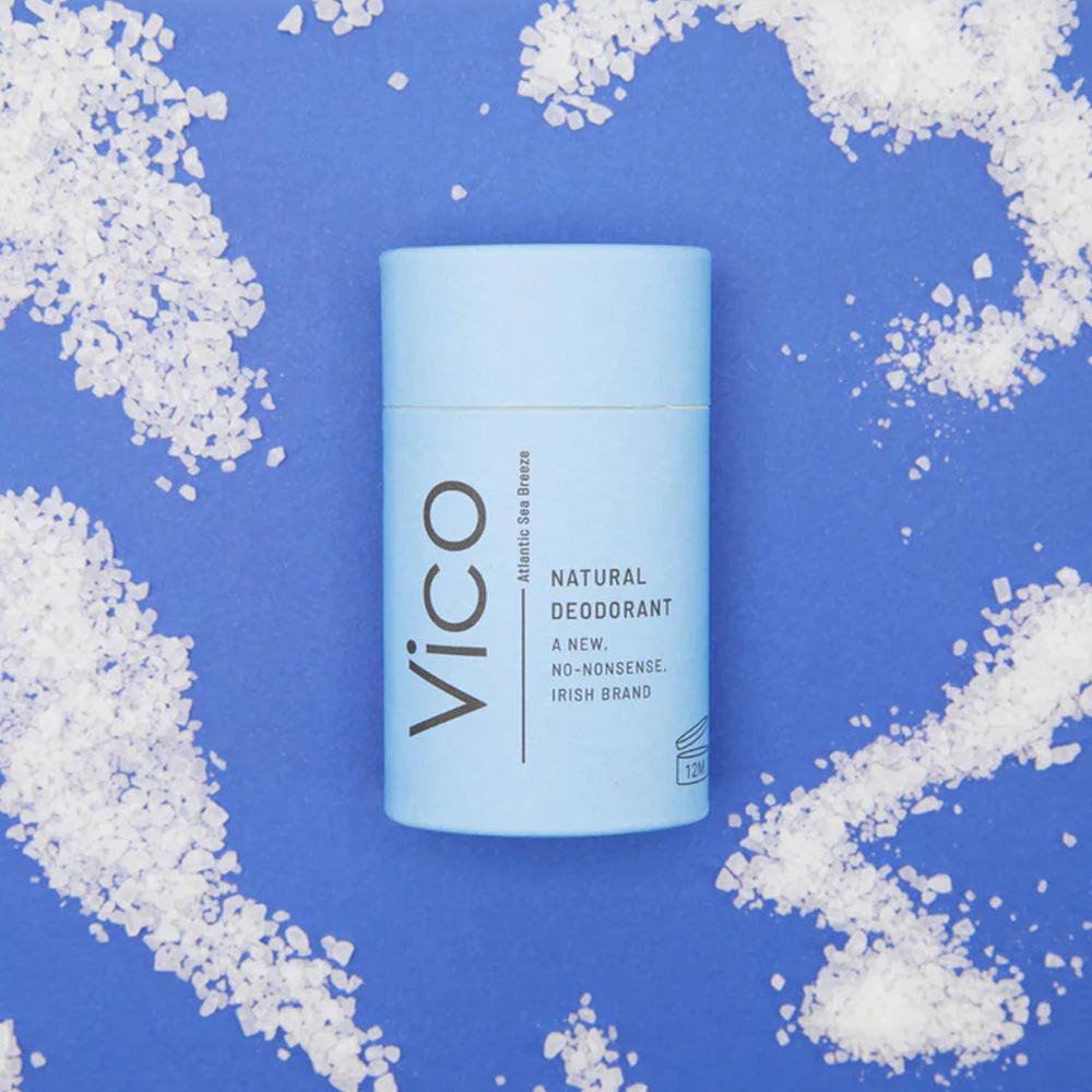 Vico natural deodorant on a blue background with white salt crystals