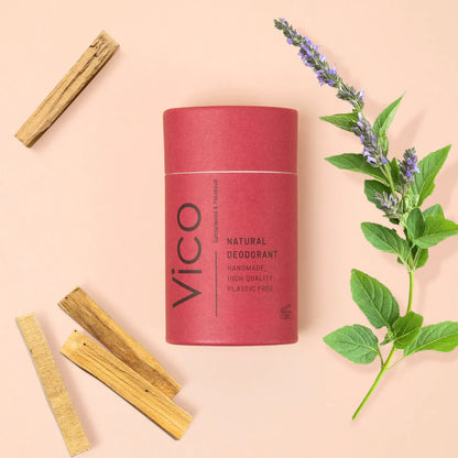 Red Vico deodorant can with cinnamon sticks and lavender on a beige background