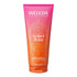 A 200ml squeeze tube of Weleda Natural Science Amber Divine Limited Edition Scented Shower Cream, featuring a vibrant pink-to-orange gradient design with white and gold text.