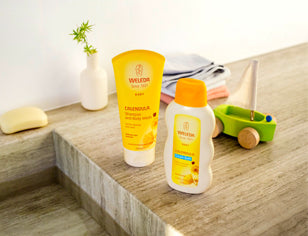 Weleda baby range in bathroom with toy boat