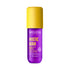A bottle of Weleda Mystic Aura Fragrance Body & Hair Mist, featuring a vibrant purple bottle and a bright yellow cap, set against a plain white background.