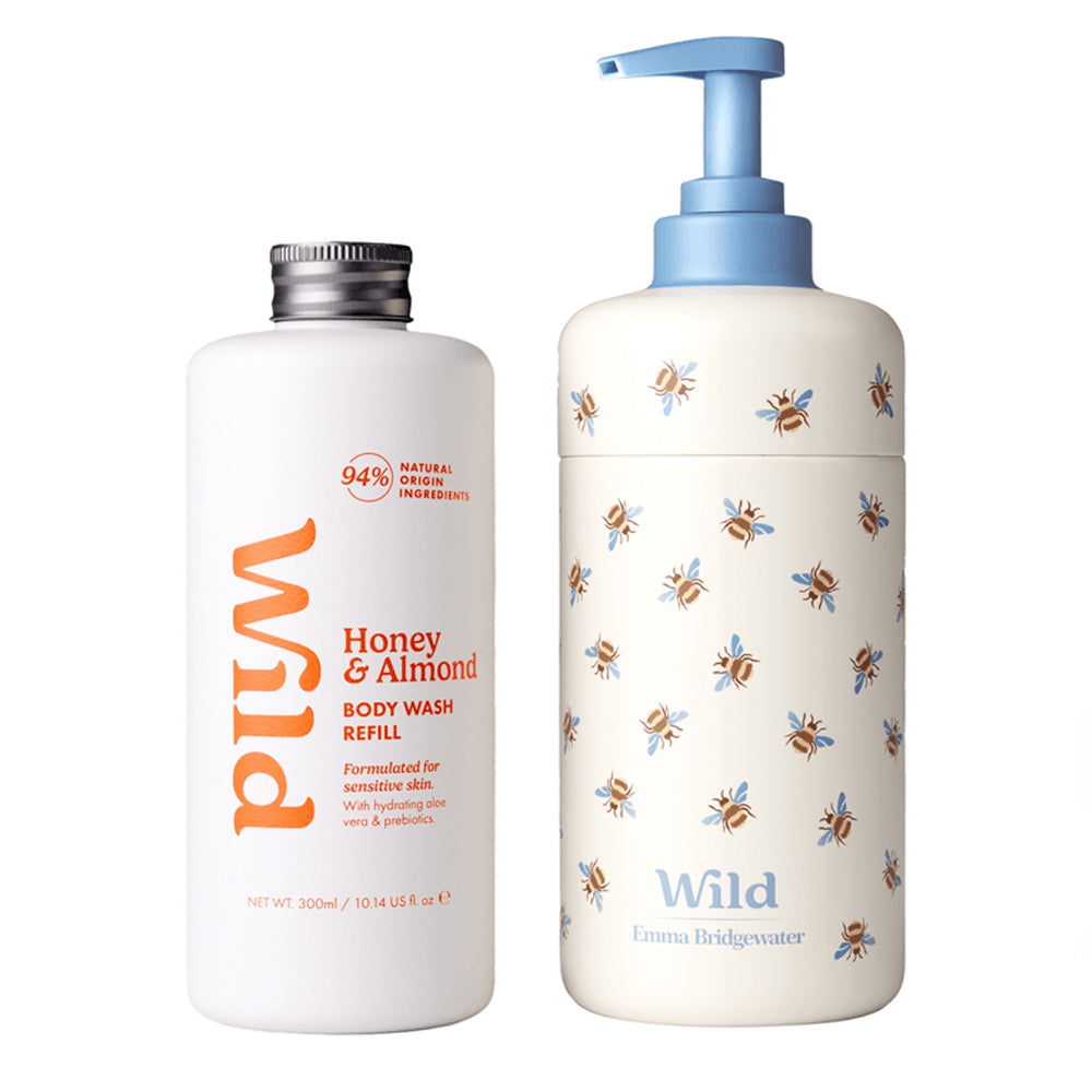 Wild Emma Bridgewater body wash refill bottles on a white background. On the left is a white bottle with a silver cap labeled &