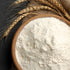 True Natural Goodness Organic Barley Flour in wooden bowl